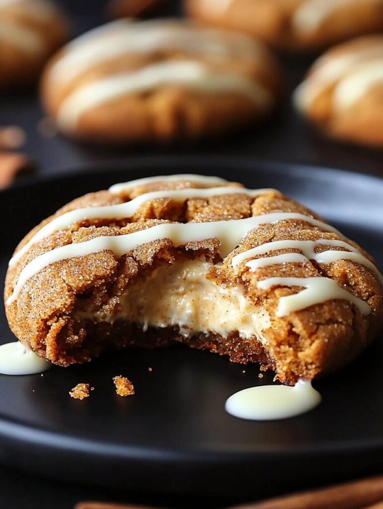 Cheesecake-Filled Snickerdoodle Cookie with White Chocolate Drizzle