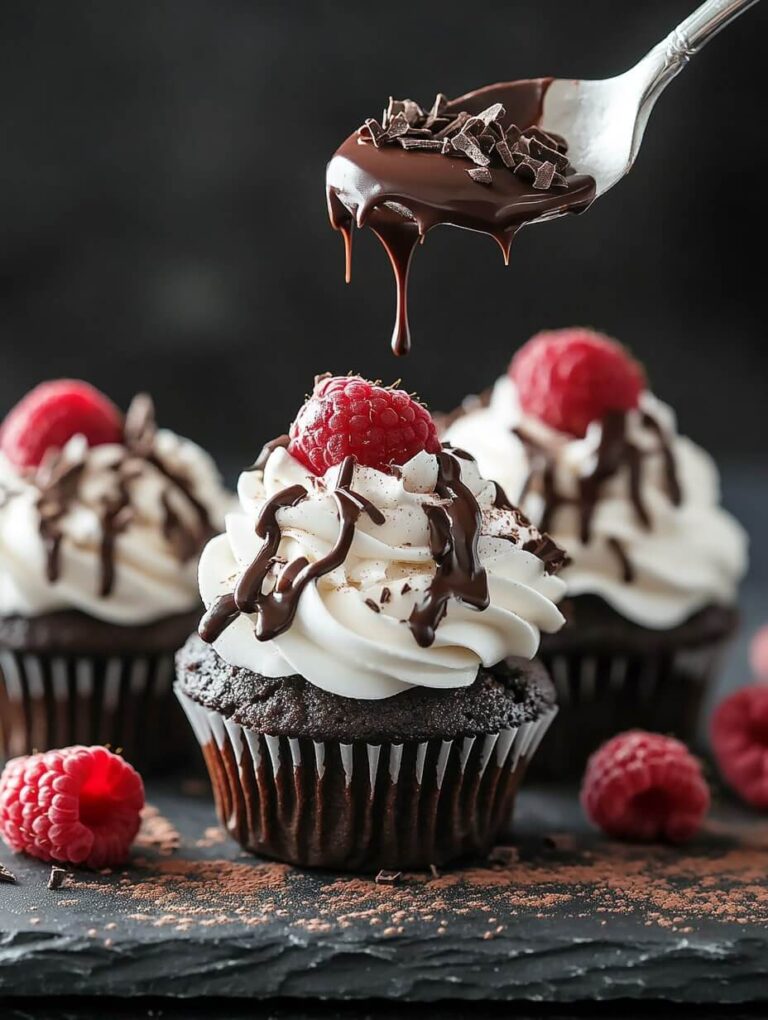 Decadent chocolate raspberry cupcakes with a drizzle of rich chocolate